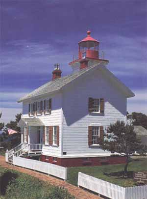 This postcard image shows the Yaquina Bay Lighthouse, site of the legendary and presumably fictional murder of "Muriel."