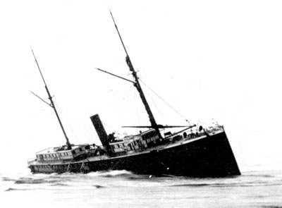 The stranded S.S. Yaquina City wallowing on the beach north of the Yaquina Bay entrance.